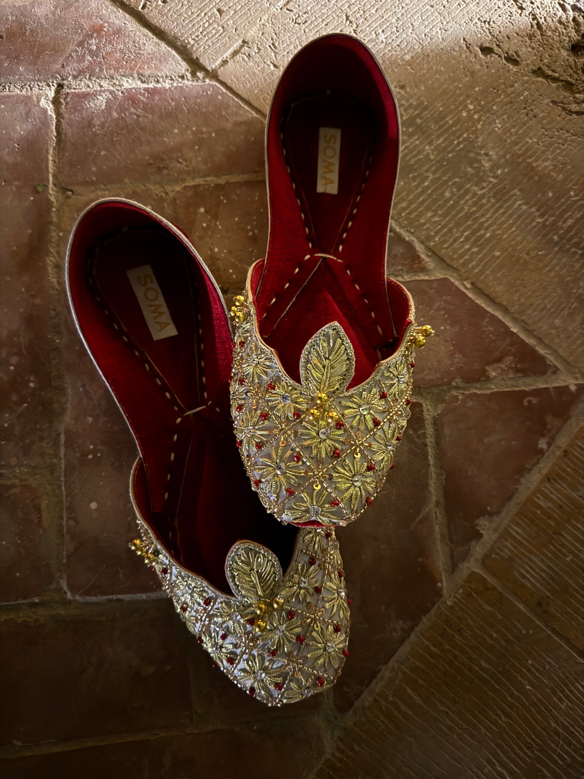 Gold gota flowers on SOMA CHAMELI bridal khussa